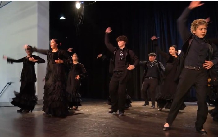 Tierra Adentro NM Charter High School students dancing on stage